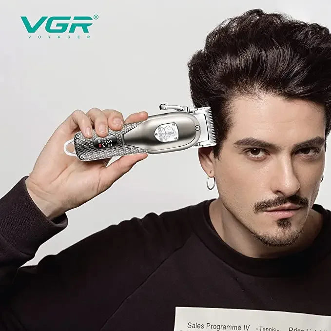 Man using VGR hair clipper for styling hair, close-up of grooming tool and hairstyle